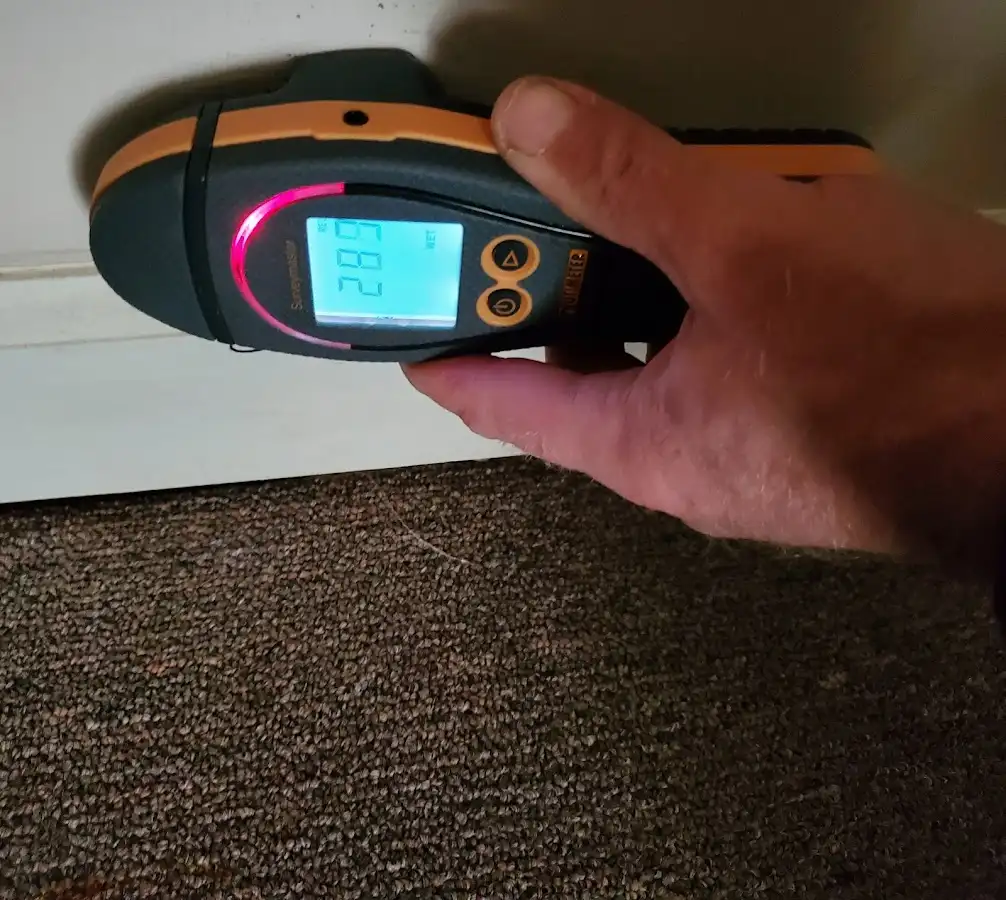 Moisture detection at baseboard during Burst Pipe Cleanup in Ewa Gentry